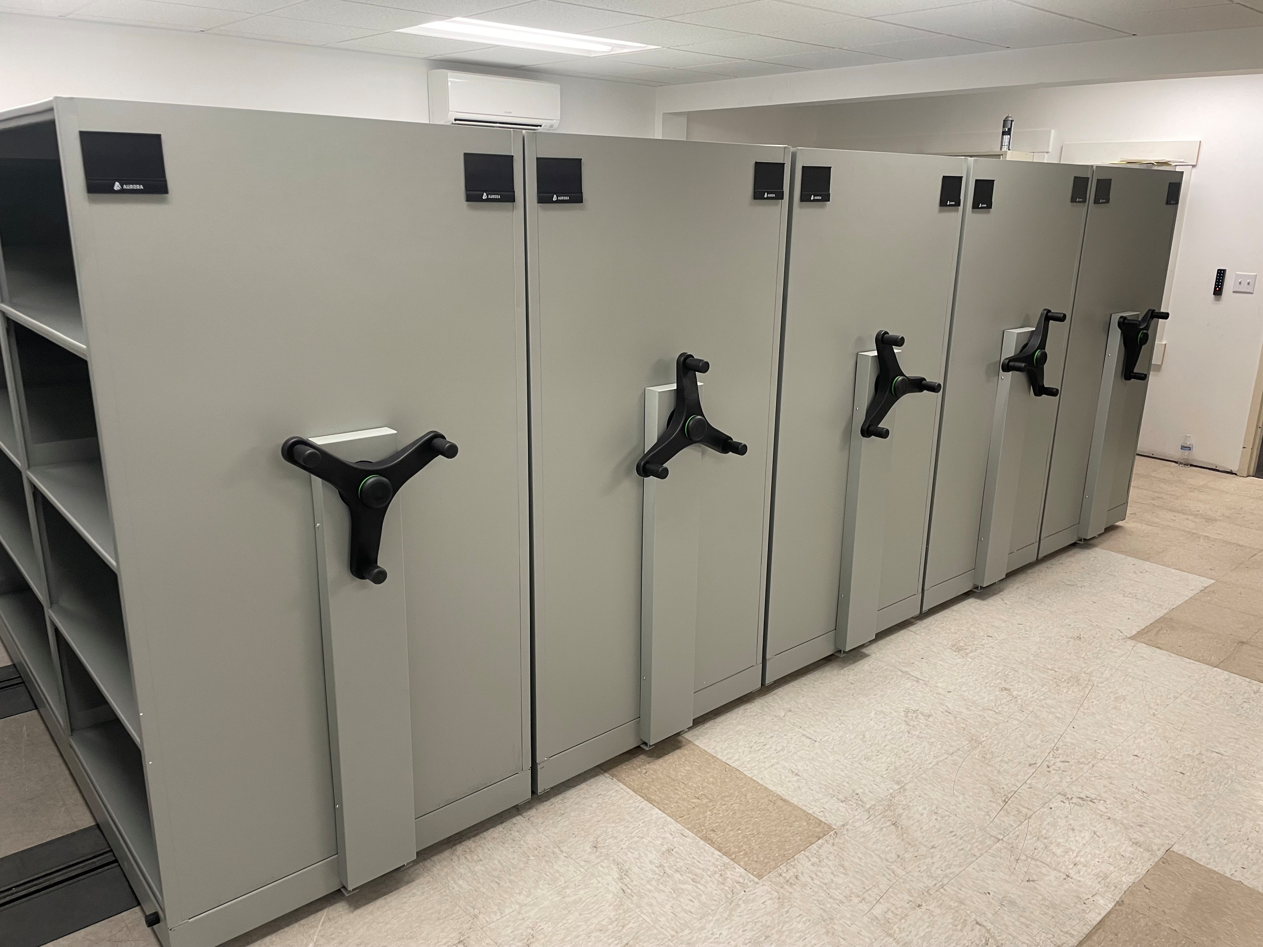 Completed mobile shelving installation at Roy Police Department evidence room showing maximum space utilization
