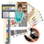 A woman works at a desk equipped with a laptop and folder, while Smead WaterGuard Label 8, 7-Up Sheet (02483) folders offer color-coded organization. She scans a folders barcode into a spreadsheet on her screen and references the 7-Up Sheet from its numbered file tab.