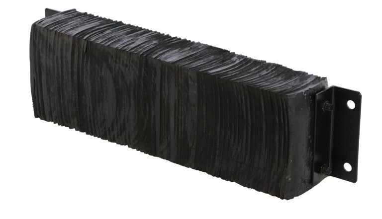 A close-up of a sturdy black brush resembles the durability of a Vestil Laminated Dock Bumper 10 X 36 X 6 In. Its metal base with mounting holes indicates its for attachment, while worn bristles add to its rugged charm.