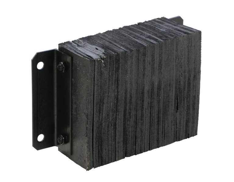 1218-6_A.jpg The Vestil Laminated Dock Bumper 12 x 18 x 6 inches is a black, rectangular rubber bumper with a ridged texture. It mounts vertically with a metal bracket featuring two bolt holes on the left side for secure attachment.