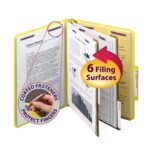A person showcases the Smead Pressboard Classification File Folder in yellow, featuring SafeSHIELD® fasteners on six surfaces, with a focus on a Coated Fasteners Protect Fingers label, and another labeled 2 Expansion.