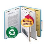 The blue Smead 100% Recycled Pressboard Classification File Folder, featuring 2 dividers and offering six filing surfaces, showcases its multifunctionality with a circular green 100% Recycled Stock icon and a prominent yellow and red arrow.