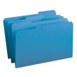 Four blue Smead File Folders (1/3-Cut Tab, Legal Size, 17043) are seen in a staggered upright formation. Tabs at the top of each folder allow for labeling. The image presents them in an orderly fashion against a simple white background.