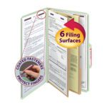 Illustration of a Smead Pressboard Classification File Folder, Gray/Green, Legal Size (19076), with six surfaces and two dividers. A red arrow highlights this and a circular inset shows a hand by a SafeSHIELD Fastener with the label Coated Fasteners Protect Fingers.