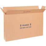 A large, open 22 x 6 x 16 MH-USA Flat-Panel TV Box is shown, crafted from brown corrugated cardboard and marked FRAGILE and DO NOT LAY FLAT with arrows, ideal for safe shipping or storage.