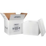 A white insulated box with its lid off is next to an open MH-USA 16 3/4 x 16 3/4 x 15 Insulated Shipping Kit cardboard box that has Perishable This Side Up and Rush Perishable Insulated instructions on it.