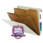 A trio of tan file folders with labeled tabs, featuring multiple sections, is open. The foreground prominently displays the Smead End Tab Classification File Folder with SafeSHIELD Fasteners, Letter Size in Gray/Green (26710), with a color-coded label numbered and a month tab on the side.