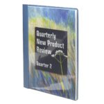 The Quarterly New Product Review Quarter 2 document is elegantly displayed in a Smead Clear Front Report Cover (87452) featuring three double tang fasteners, a blue spine, and a painted grass-and-white flower background with a 1/2 capacity.