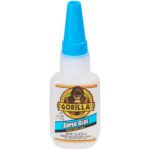A white bottle of .5 oz. Gorilla® Super Glue with a blue cap and gorilla logo is impact-tough. Sold in a 4/Case set, this essential adhesive keeps you ready for repairs.