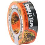 A roll of 2 x 30 yds. Gorilla® Duct Tape in black features a gorilla logo and is renowned for its durability and strength, perfect for demanding tasks.