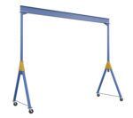 The blue Vestil Knock-Down Adj Steel Gantry 6K 20 X 16 crane with yellow accents has four wheels for mobility. Its design includes a horizontal beam supported by two adjustable vertical beams, facilitating easy positioning and movement.