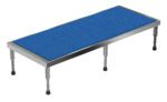 The modern rectangular bench, similar to the Vestil Adj Alum Stand 9.5-15.5 H 24 X 60, features a blue cushioned top and sleek metallic frame with four extendable legs and black rubber feet, blending style and functionality while offering adjustable height from 9.5 to 15.5 inches.