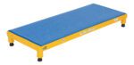 A low rectangular exercise step platform features a blue non-slip top and yellow frame, evoking the stability of the Vestil Adjust Steel Stand 6.75-8.75 H 19 X 48, with four black rubber feet for firm support.