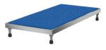 The Vestil Adjust Alum Stand 5.75-7.75 H 24X48 features a blue textured rectangular platform, metallic frame, and four adjustable legs with black rubber feet, offering a height range of 5.75 to 7.75 inches for versatile use.