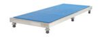 A blue gymnastics mat fits perfectly on a Vestil Adjust Alum Stand 5.75-7.75 H 24x60, covering its rectangular metal platform entirely. The setup features four visible wheels and the adjustable height ensures a minimal yet highly functional design.