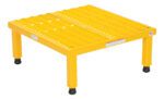 The Vestil Adj Steel Stand 10.5-16.5 H 24-06W X23.5L features a grated yellow metal surface, four legs with black rubber caps for stability, and a front safety warning label for convenience and security.