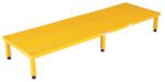 The Vestil Adj Steel Stand 10.5-16.5 H 23.5W X72.31L is a yellow metal platform with a grid pattern surface for optimal airflow or drainage, supported by four legs with black rubber feet, ideal for industrial or commercial use.