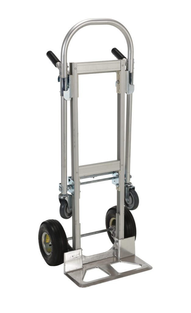ALUM-CONV_A.jpg The Vestil Alum Convertible Hand Truck 20.5 X 51.5 is a metal hand truck with a curved handle, two black wheels, a folding platform, and small swivel wheels at the base for improved maneuverability.