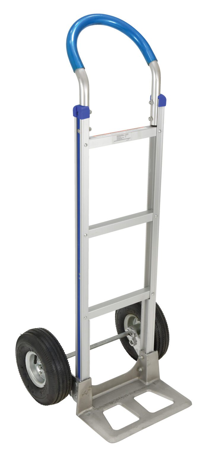 The Vestil Alum Loop Handle Hand Truck 18.5 X 49.25 has a silver frame, two black rubber wheels, and a blue handle. Its upright design features three crossbars and a flat metal base for easy item lifting.
