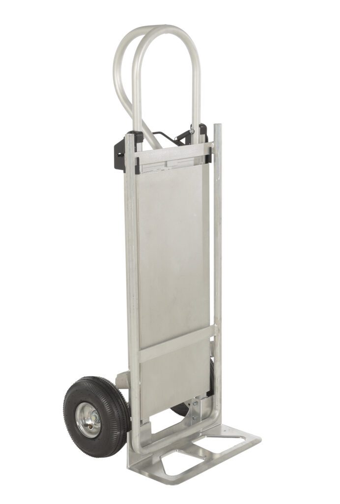 The Vestil Hand Truck W/Folding Platform Pneumatic offers a silver finish, two black wheels, and a foldable nose plate. With its curved handle, this sturdy hand truck is ideal for effortlessly transporting heavy items.