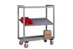 A gray Little Giant Adjustable Height Multi-Shelf Truck with two shelves on swivel casters is displayed. The top shelf holds three red storage bins, and the lower shelf carries a small cardboard box.