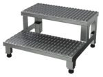 The gray Vestil Adj Alum Step Mate Stand 2 Step 24.06 X 22.75 features an industrial design, metallic steps with embossed non-slip surfaces, and four black rubber feet, emphasizing functionality and durability for various tasks.