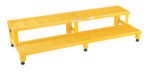 The Vestil Adjust Step Mate Stand 2 Step 59.75 x 22.87 in is a yellow metal platform with two perforated steps and four adjustable legs, designed for safety in industrial or commercial settings.