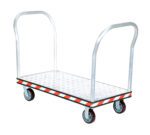 The Vestil Alum Treadplate Platform Trk 24X45 Dual Hdl features a diamond-patterned surface for grip, dual handles, and four wheels. Its edges have red and white stripes for enhanced safety.