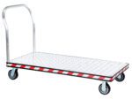 The Vestil Alum Treadplate Platform Trk 30X60 is a sturdy trolley with a diamond-patterned platform, bold black and red trim, four wheels, and a single upright handle for easy maneuvering across tasks.