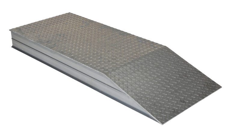ATWR-24-6-102_A.jpg The Vestil Heavy Duty Alum Wheel Riser 24X5.93X102 features a metal ramp with a textured, diamond plate surface that inclines to a flat top for sturdiness and safety, offering an excellent non-slip surface ideal for industrial use.
