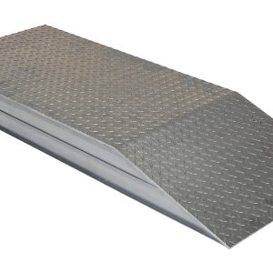 The Vestil Heavy Duty Alum Wheel Riser 24X5.93X54 includes a durable metal ramp with a diamond-patterned surface for traction and gentle incline for easy wheeled access, tapering smoothly from the elevated platform to ground level.