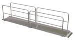 The Vestil Alum Walk Ramp Handrail Overlap 192 X 28In features an aluminum wheelchair ramp with side handrails, a slight incline, and non-slip surface for accessibility, highlighted by a white background that accentuates its metallic construction and straightforward design.