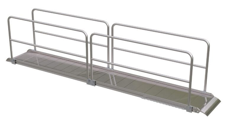The Vestil Alum Walk Ramp Handrail Overlap 192 X 28In features an aluminum wheelchair ramp with side handrails, a slight incline, and non-slip surface for accessibility, highlighted by a white background that accentuates its metallic construction and straightforward design.