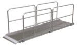 The Vestil Alum Walk Ramp Handrail Overlap 144 X 38 In offers a non-slip surface, extended lip for smooth transitions, and utilitarian design to enhance accessibility across different environments.