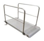 The Vestil Alum Walk Ramp Handrail Overlap, measuring 84 x 38 inches, is designed for accessibility with sturdy handrails and a slightly inclined surface, making it ideal for wheelchairs and mobility aids while blending functionality and design against a white background.