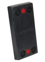 A sleek, black rectangular block resembling the Vestil Rectangle Molded Rubber Bumper 24X12X3 Blk with red circular inserts at both ends and four recessed screw holes in each corner.