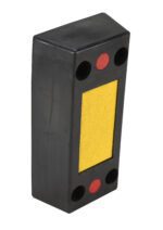 The Vestil Rectangle Molded Rubber Bumper 24X12X6 Blk resembles a domino with a yellow center, featuring two red circles and four smaller black ones arranged like a face.