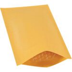 A 5 x 10 Kraft Lbs00 Heat-Seal Bubble Mailer partially opens to reveal its protective bubble wrap. Angled to show its textured exterior, its ideal for secure shipping and available in a 25 pack.