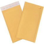 Two yellow padded envelopes are displayed; one lies flat showing its front, and the other is angled to reveal a peel-and-seal strip at the top. These durable 5 x 10 Kraft Lbs00 Self-Seal Bubble Mailers with Tear Strip ensure reliable mailing and shipping.