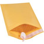 A 7 1/4 x 12 Kraft Lbs1 self-seal bubble mailer is displayed open, showcasing its bubble wrap lining. The white and red seal strip is partially peeled. Angled against a clean white background, this durable envelope comes in cases of 100.
