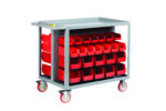 The Little Giant Bin Cart is a gray utility cart with removable red bins on four rows per side for efficient storage. It has caster wheels for easy mobility and a flat top surface, offering practical versatility.
