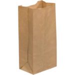 A 4 5/16 x 2 7/16 x 7 7/8 plain brown Kraft Grocery Bag with a flat bottom and crinkled top edges stands on a neutral background, featured as part of the Kraft Grocery Bags collection (500/Case).