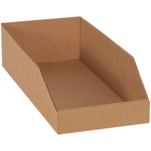 A 12 x 24 x 4 1/2 brown rectangular Kraft bin box with raised sides and a slanted front, available in bundles of 50, is depicted on a plain white background.
