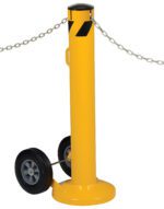 A yellow wheeled stanchion, like the Vestil Movable Bollard W/ Slots 42 x 5.5 In, features a black cap, two base wheels, a top metal chain, and side handle for easy transport.