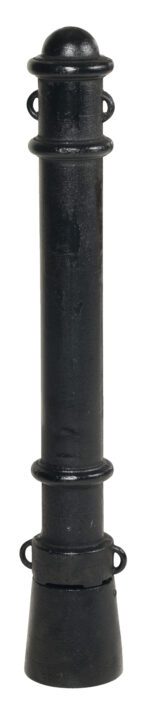 The Vestil Ornamental Steel Bollard Surface Mount showcases a tall black cylindrical design with two horizontal ridges and circular loops at the top and bottom. Its wide base supports the column, with a textured, slightly worn surface.