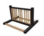 An upside-down wooden structure, similar to a bed frame with vertical slats and a simple rectangular design, reflects the contrasting black and cedar tones of the Vestil Bike Rack Black/Cedar 6 Positions.