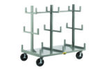 The Little Giant Heavy-Duty Bar & Pipe Truck features four large wheels, a flat base, and multiple vertical and horizontal supports for holding panels or large flat items. Painted light gray, it provides robust transport solutions for heavy-duty needs.