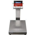 The Vestil Bench Scale Portable 18x24 device, branded Optima, features a metallic platform, elevated display panel with buttons below the screen, and red and black casing. It shows a weight of 19.1 and supports up to 500 lbs.