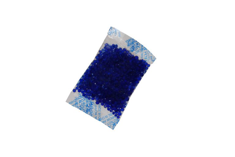 The Vestil Moisture Absorbing Blue Silica 600 Pcs packet, filled with bright blue silica beads, rests elegantly on a pristine white background.
