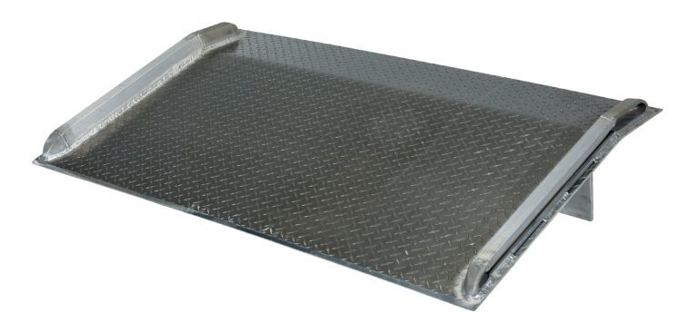 BTA-06007872_A.jpg The Vestil Aluminum Truck Dockboard 6000 Lbs 78X72, featuring a diamond plate surface and raised edges, ensures durability and traction. Its robust design is perfect for heavy-duty loading tasks.